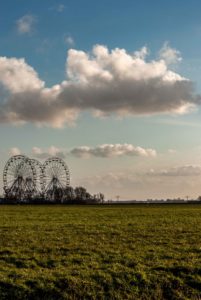 green field and Ferris wheels