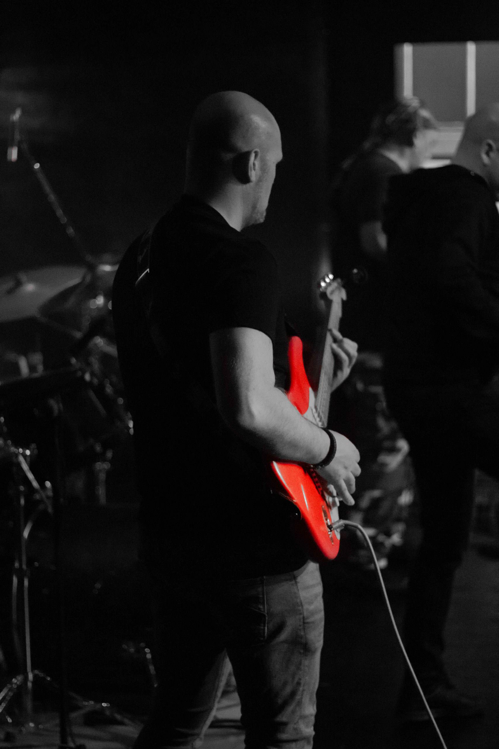 guitar player with red guitar (black and white)